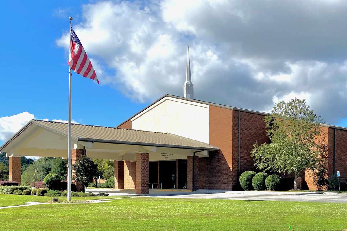This church is a metal building clad in brick and includes a drive-thru portico for parishioners to use on rainy days.