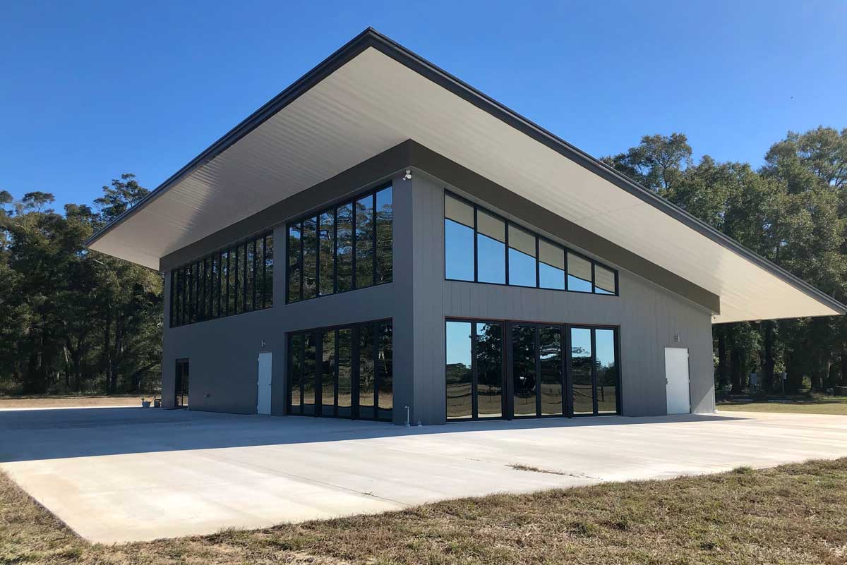This 2800 sq ft residence is a metal building with a single slope roof and large open areas to house multiple window.